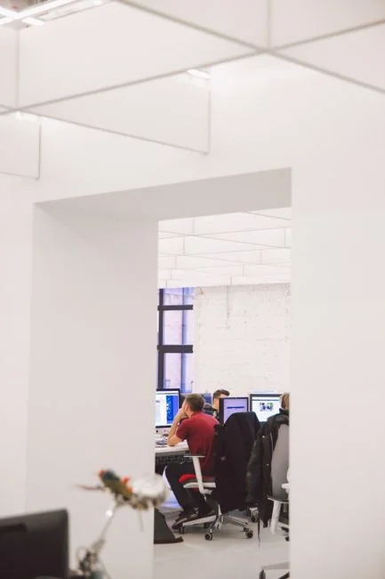 A contemporary workspace with two computer monitors showing web design projects, highlighting technology and productivity.